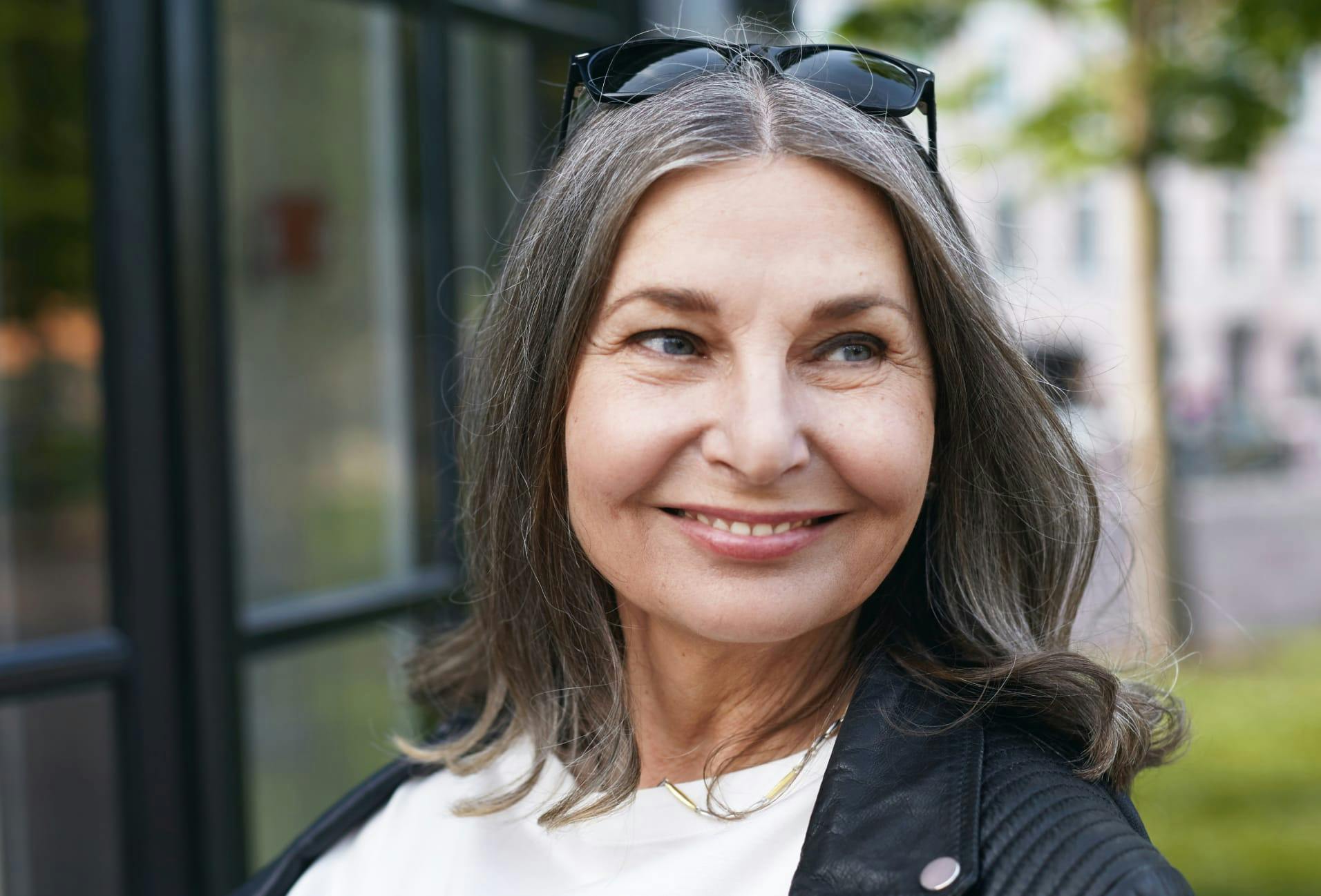 woman with shoulder length grey-ish hair