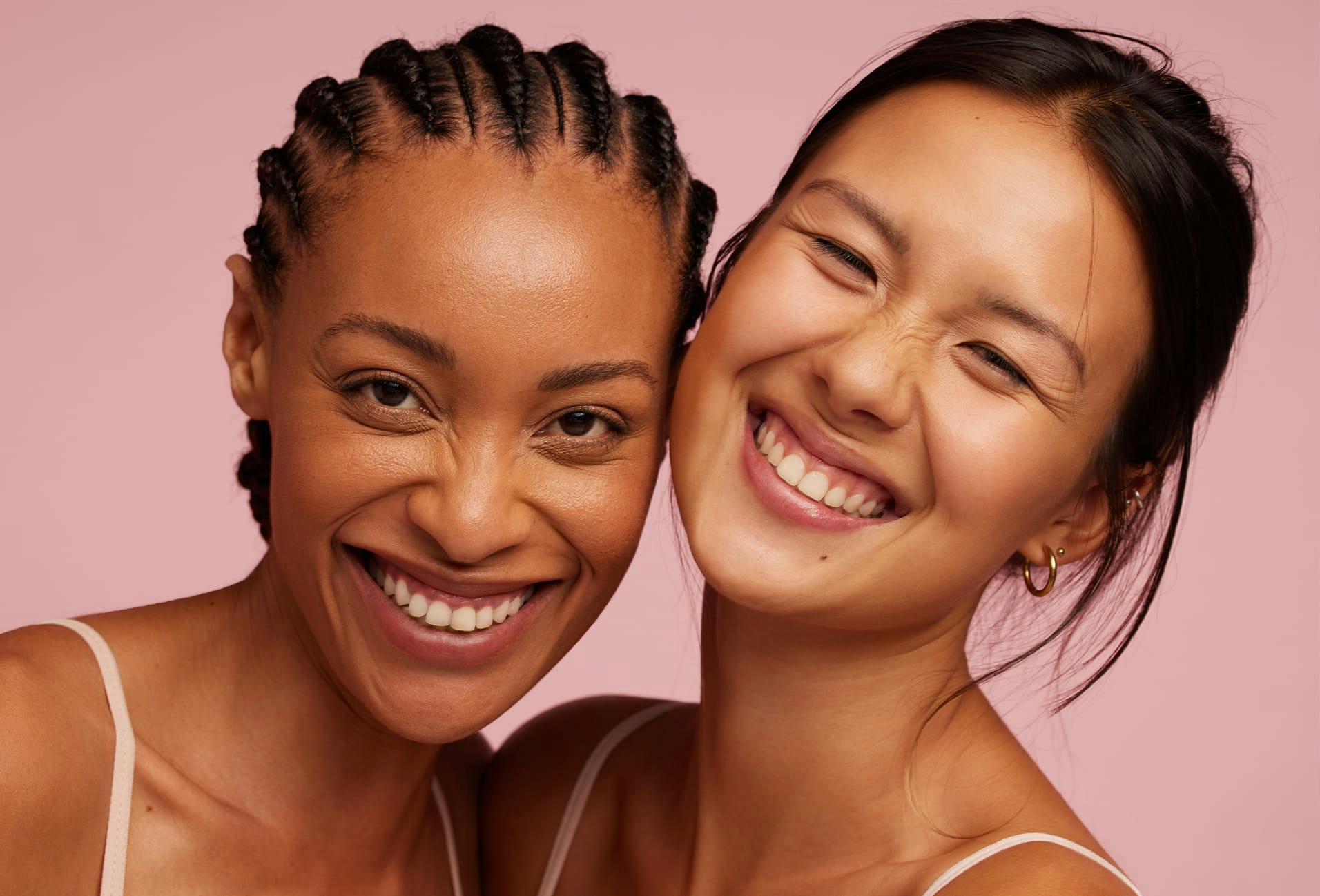 two woman smiling