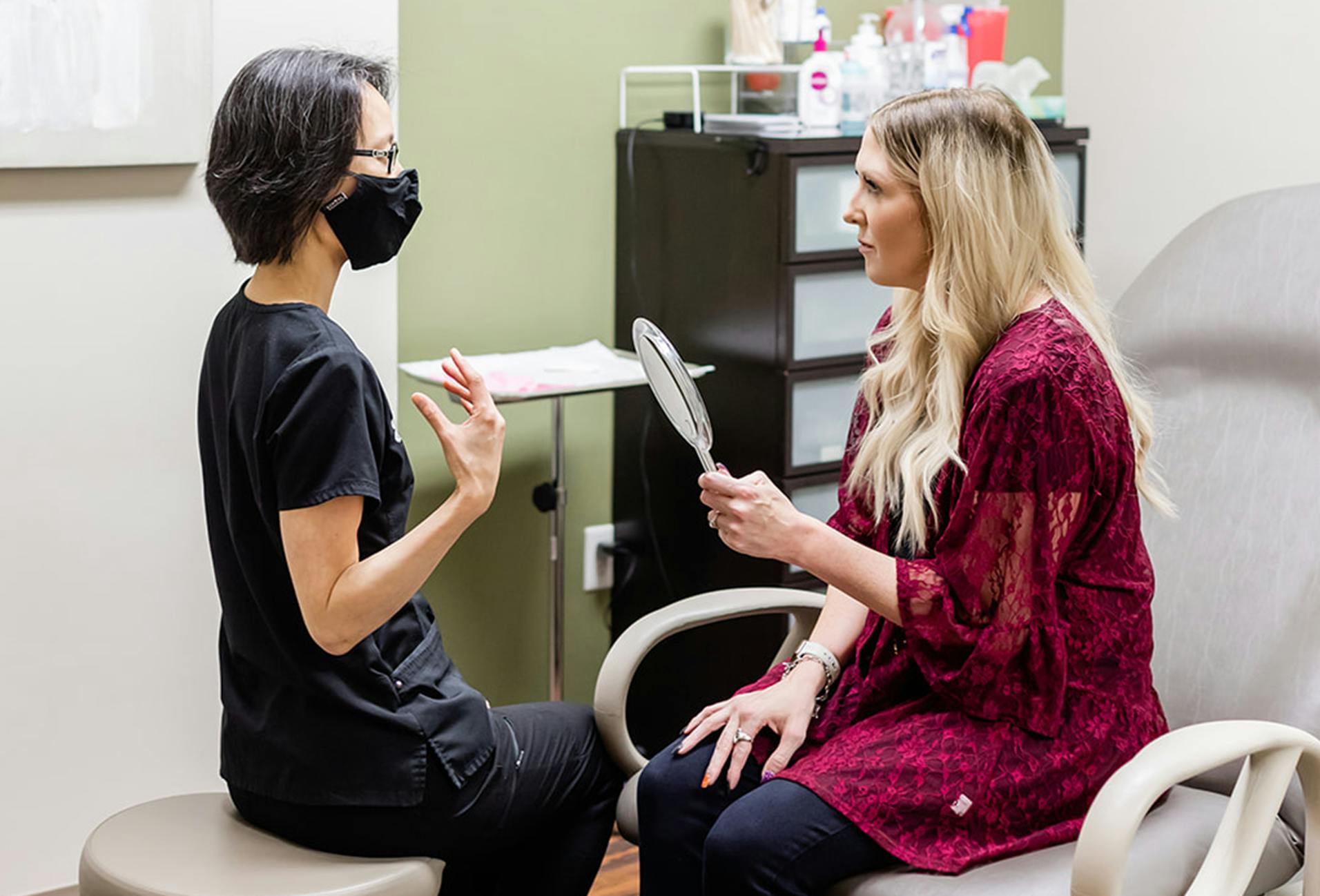 Dr. Chiang speaking with a female patient