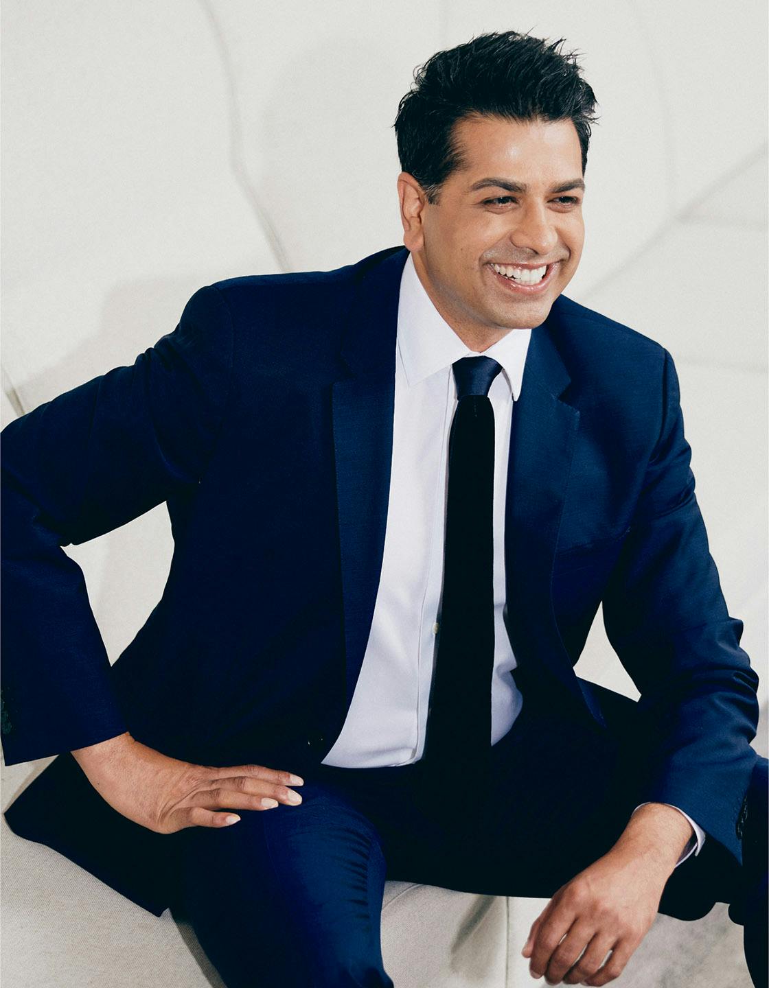 Dr. Neil Tanna in a blue suit
