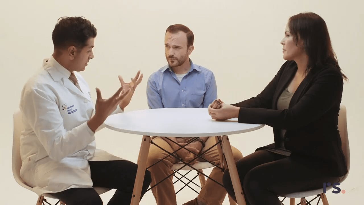 Medical Professionals Having a Discussion at a Table