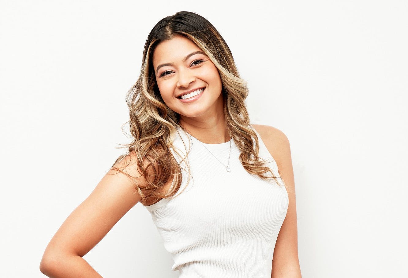 Smiling woman who recieved breast augmentation