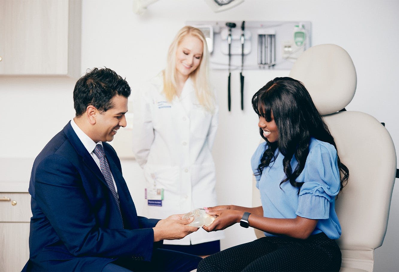 Dr. Tanna and Patient Holding a Breast Implant