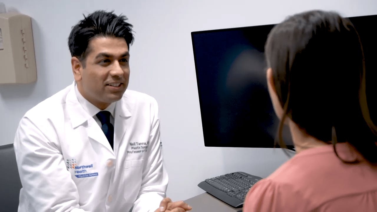 Dr. Tana Consulting with a Patient