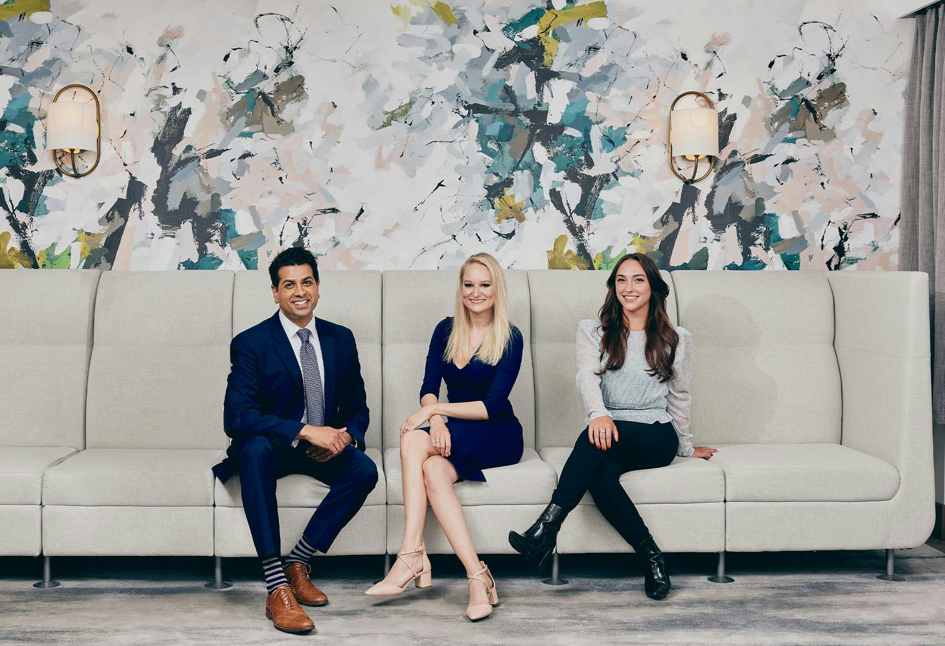 Dr. Tana and His Team Posing on the Couch