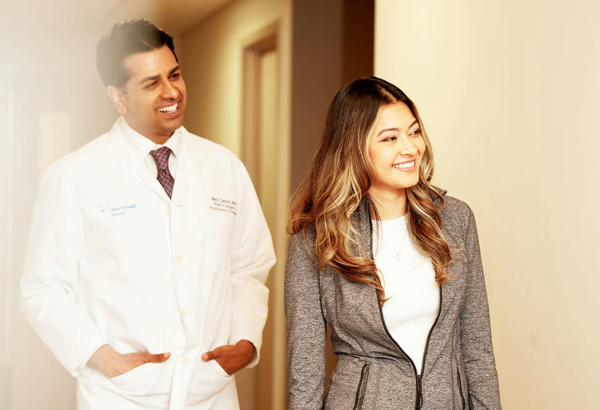 Dr. Tanna Walking with Patient