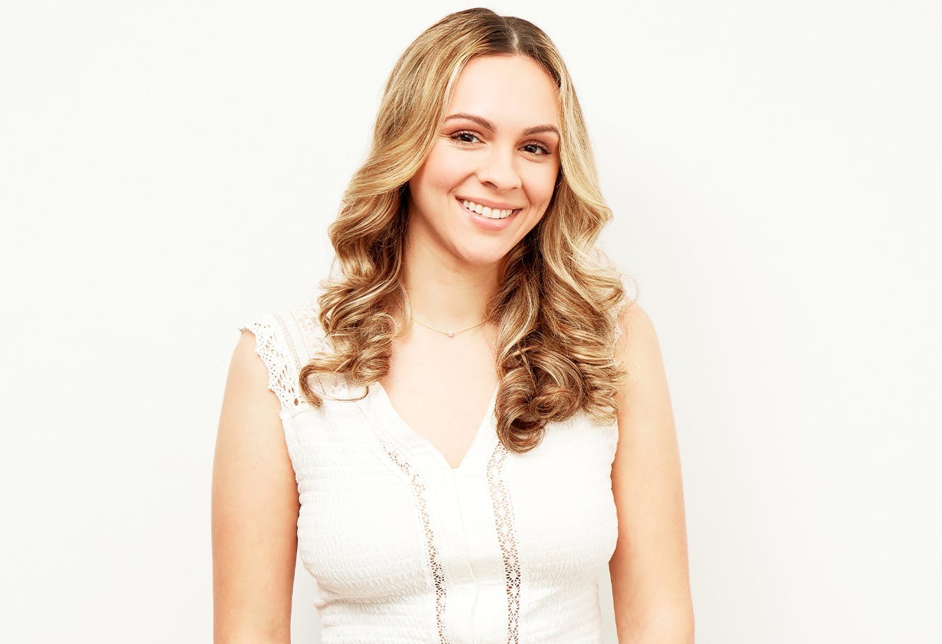 Woman with Blonde Hair and White Blouse