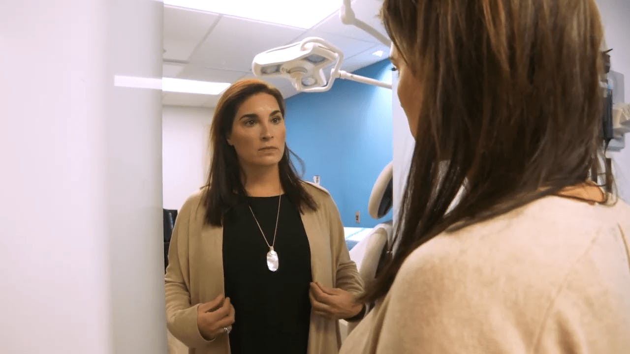 Two Women Speaking in a Procedure Room