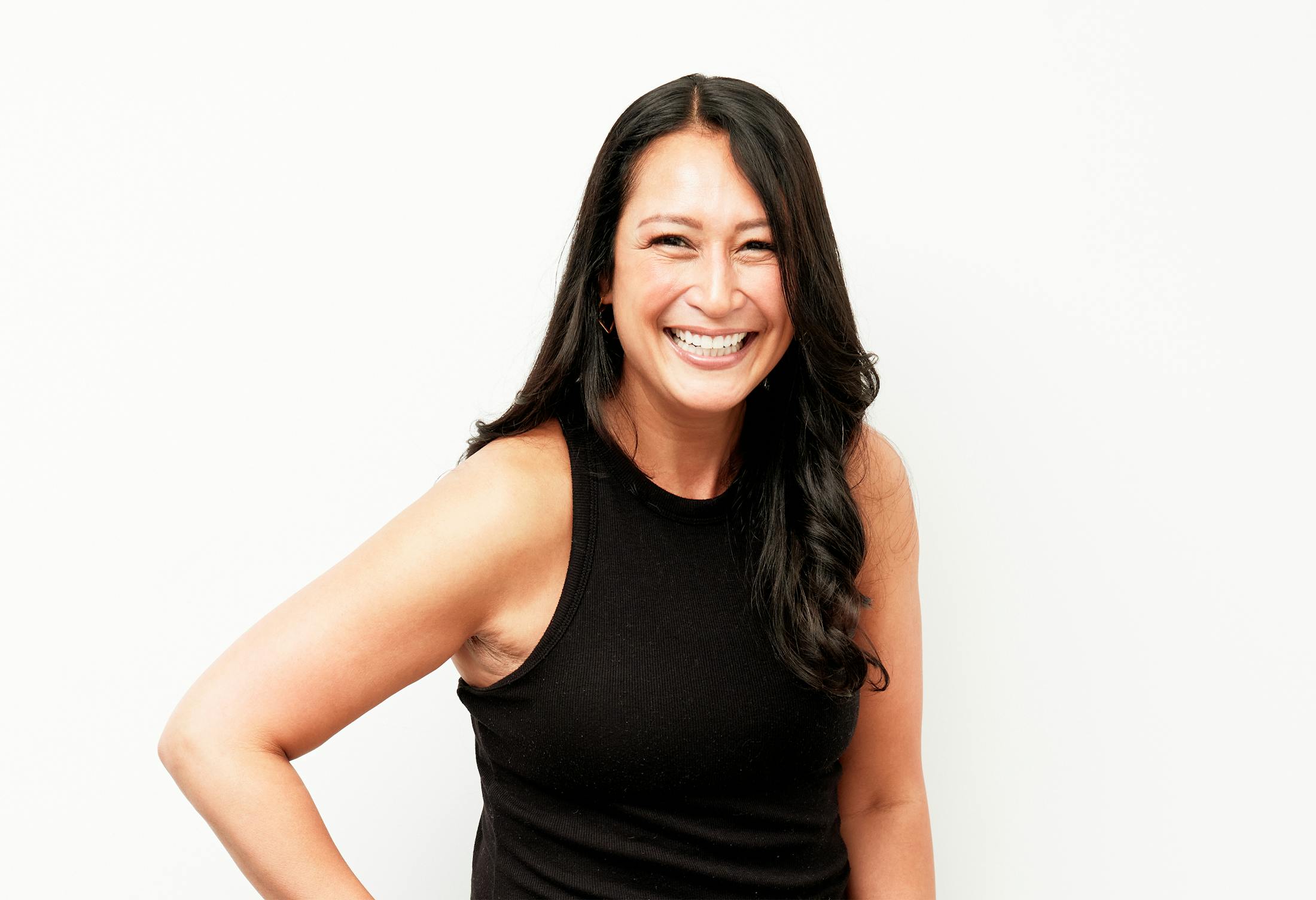Woman with a Dark Shirt and Dark Hair Smiling