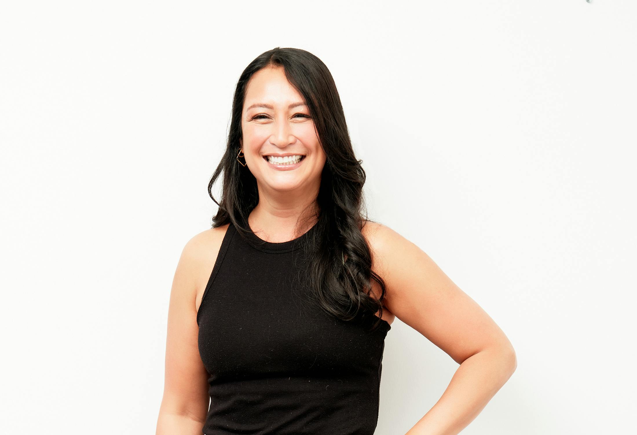 Woman with a Dark Shirt and Dark Hair Smiling