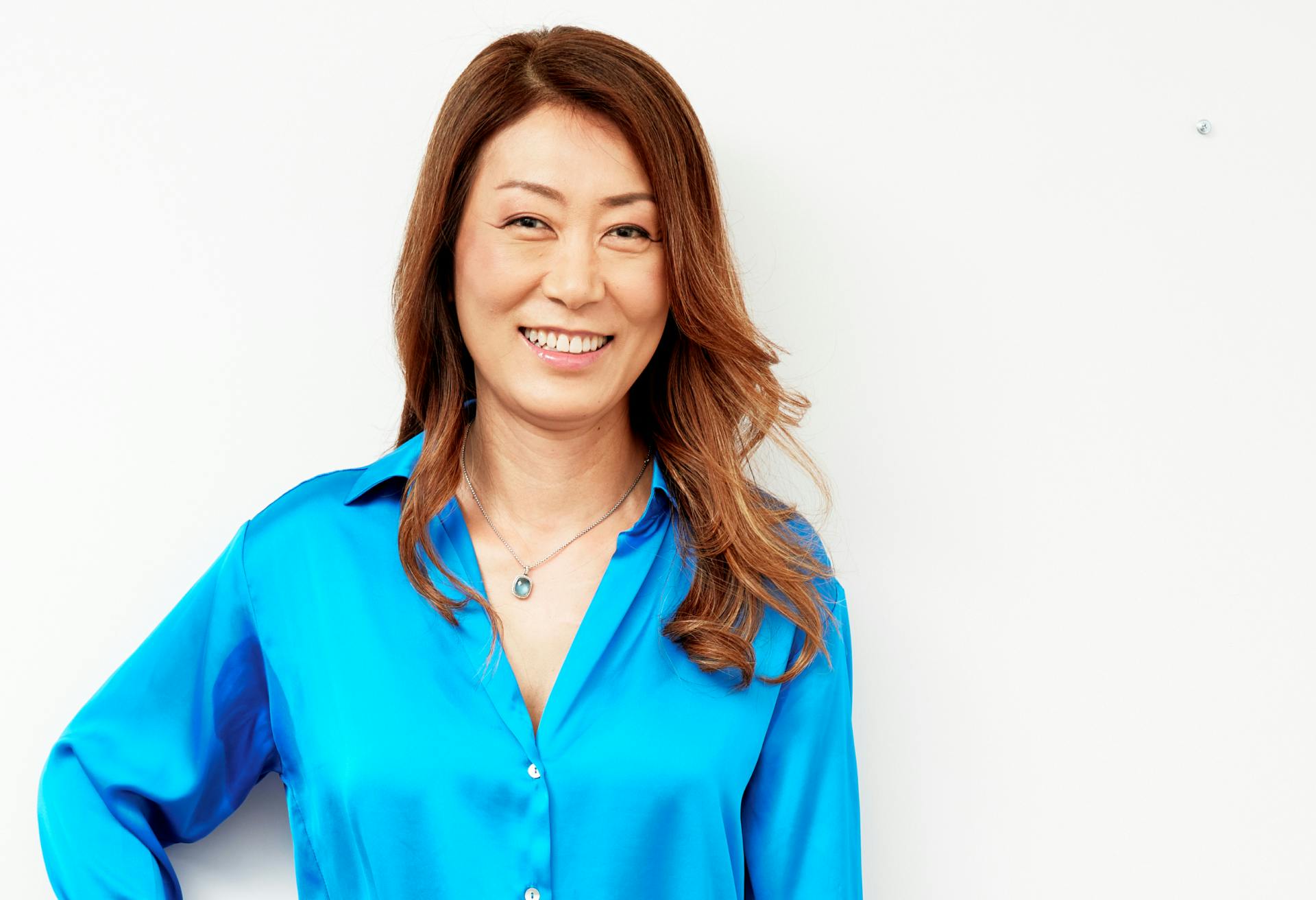 Woman in Blue Blouse Posing