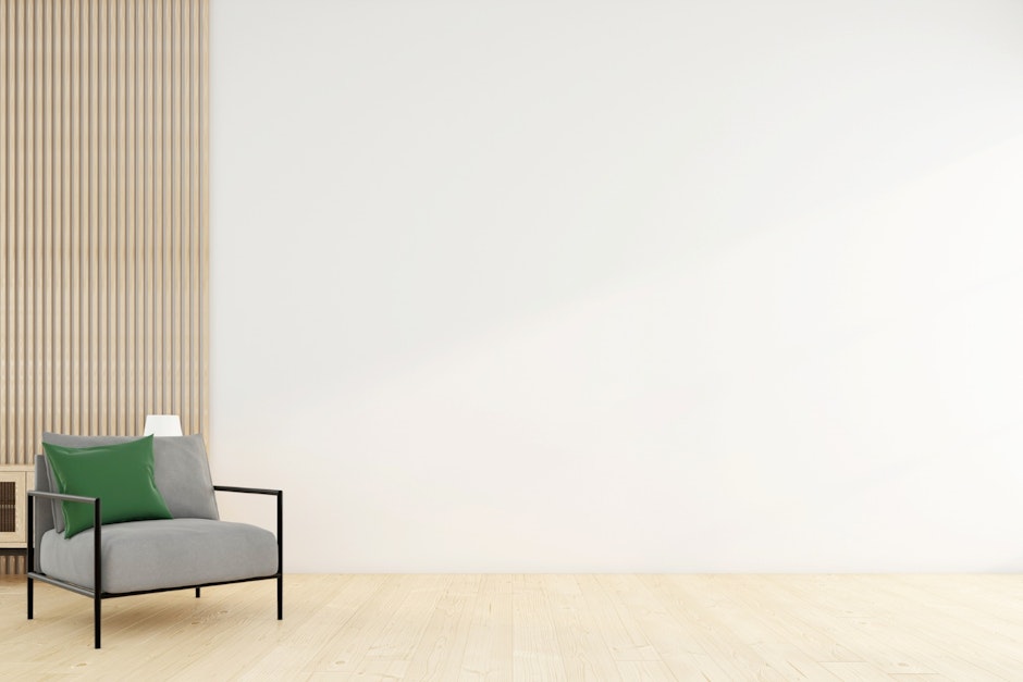 Minimalist empty room with armchair and white wall