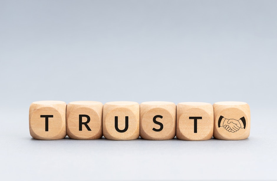 word trust spelled on wooden blocks