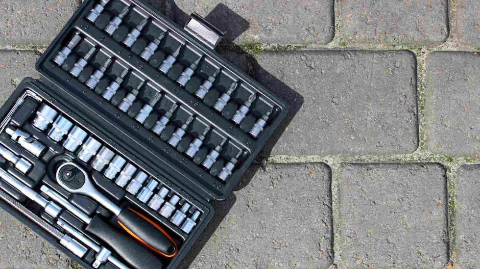 small toolkit on concrete floor
