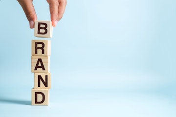 word brand on small wooden blocks