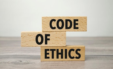 words code of ethics printed on small wooden blocks