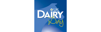 UK Dairy Day Logo displayed in white text infront of a blue backdrop which included a simple outline of a cow.