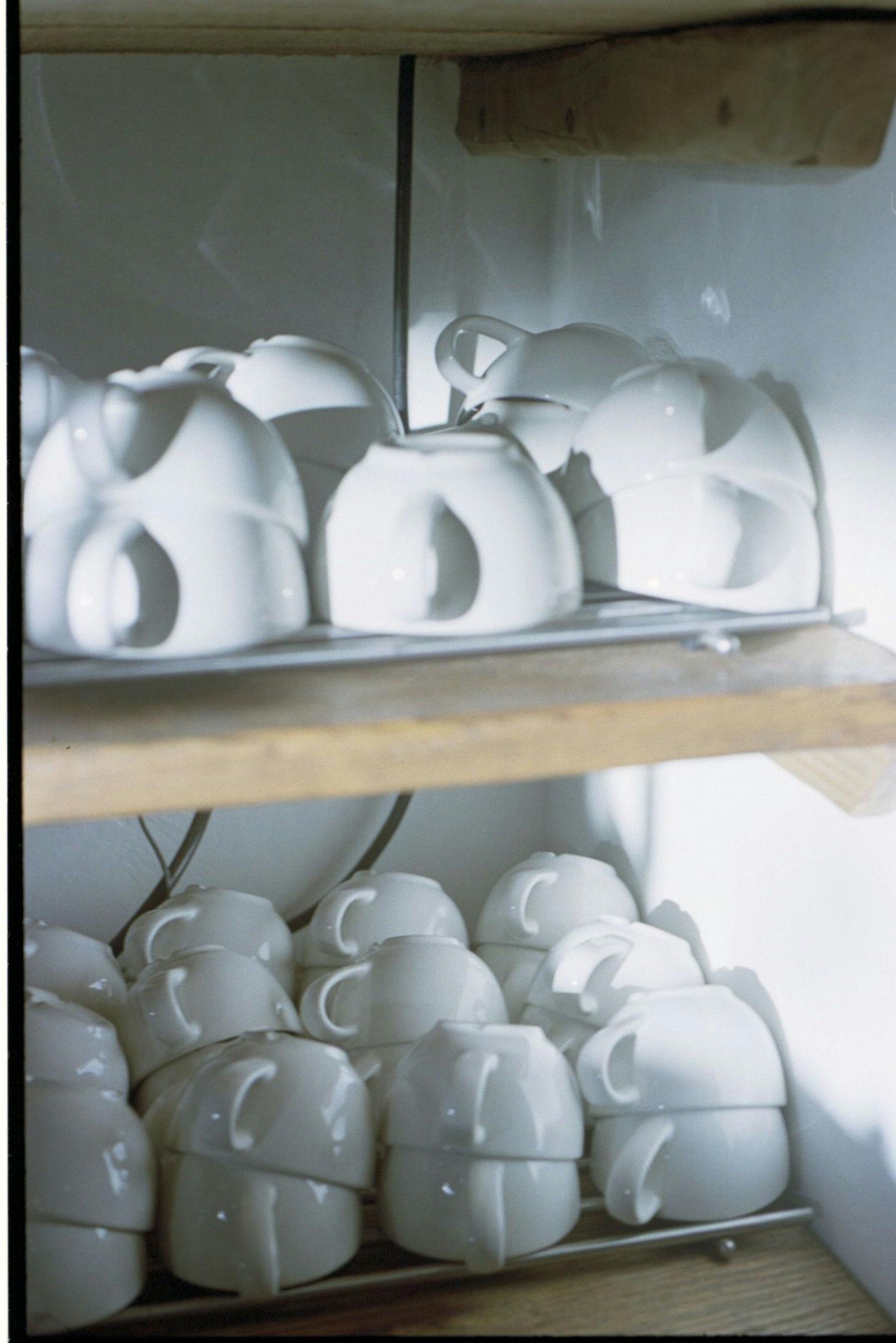 white latte cups on the shelf
