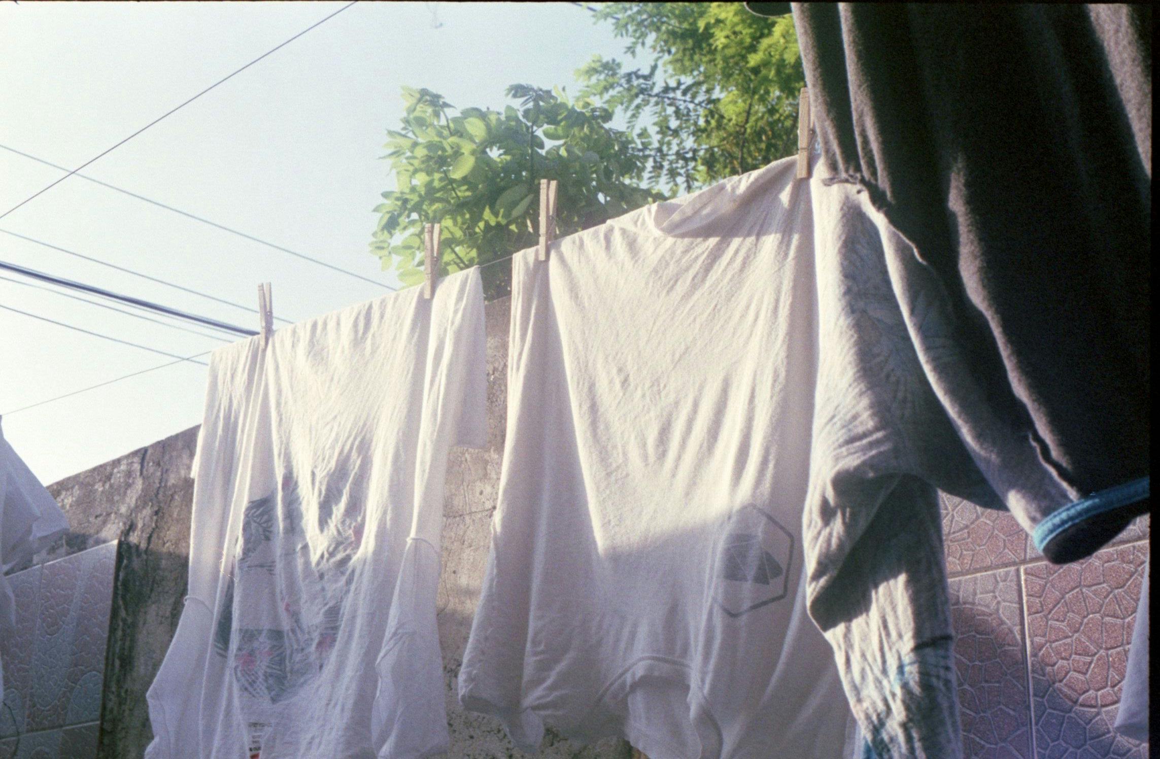 white shirts drying on the hanger chord