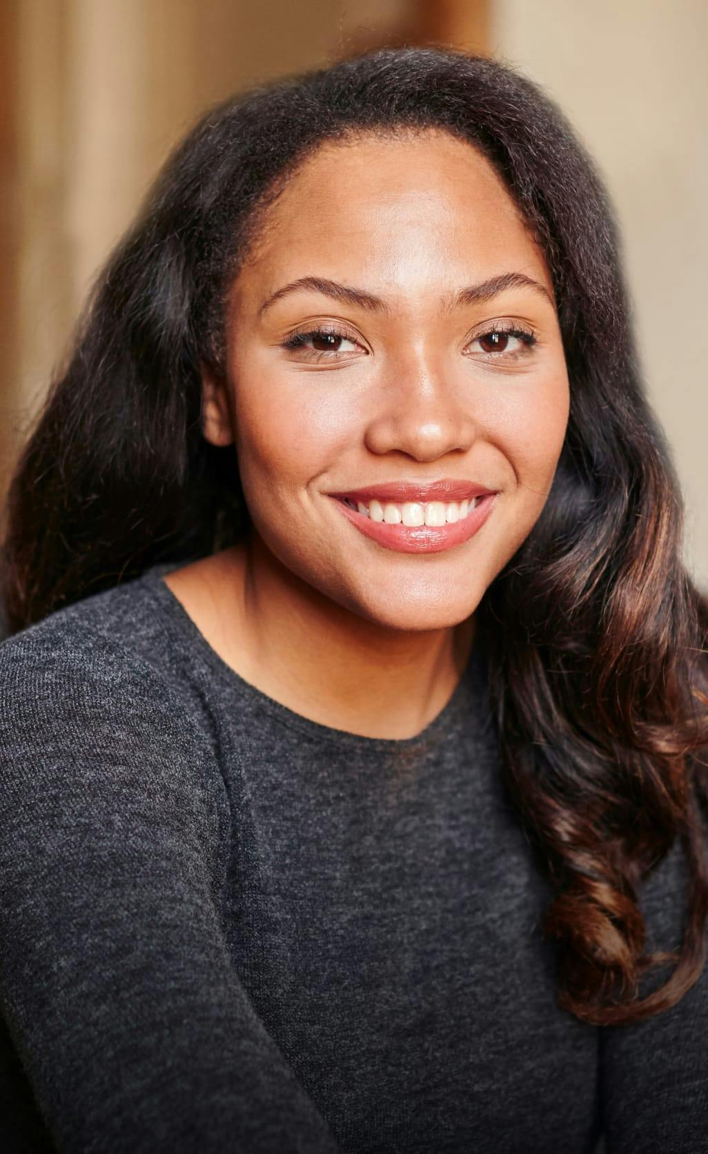 Closeup of a smiling woman's face.