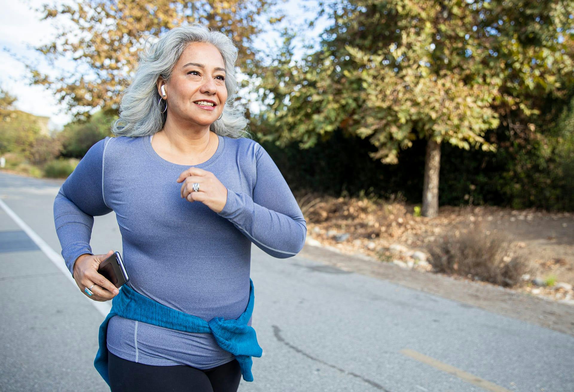 Woman running on a paved trail