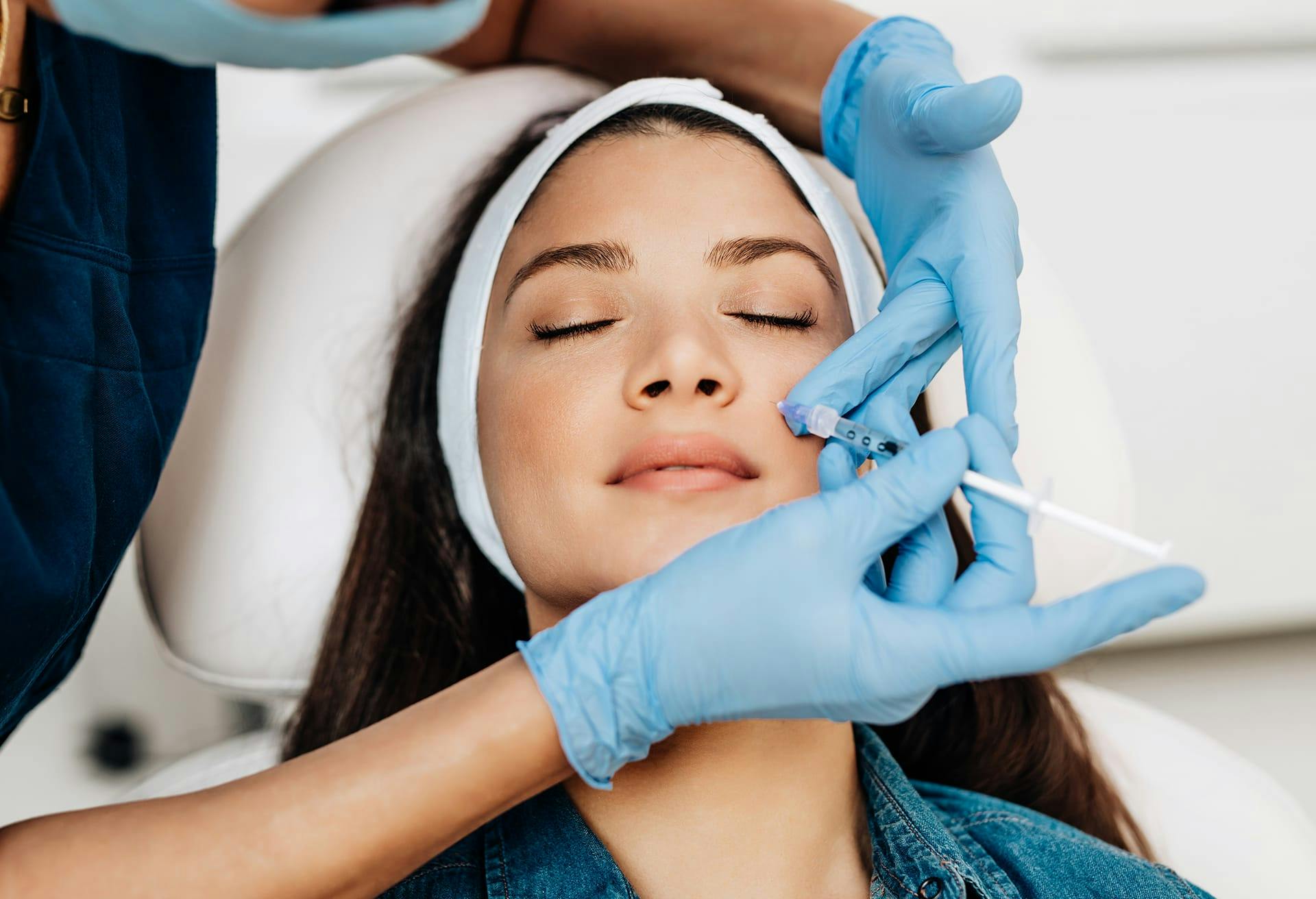 Woman getting facial injections