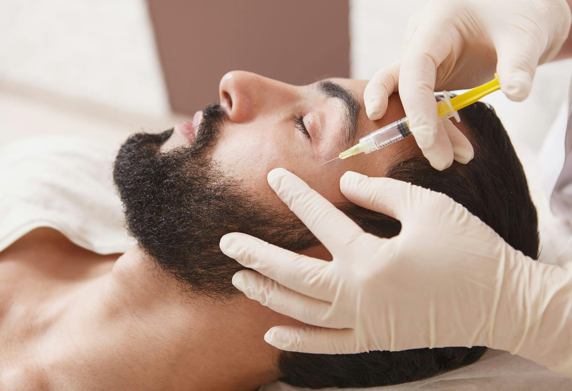 man getting an injection from a doctor