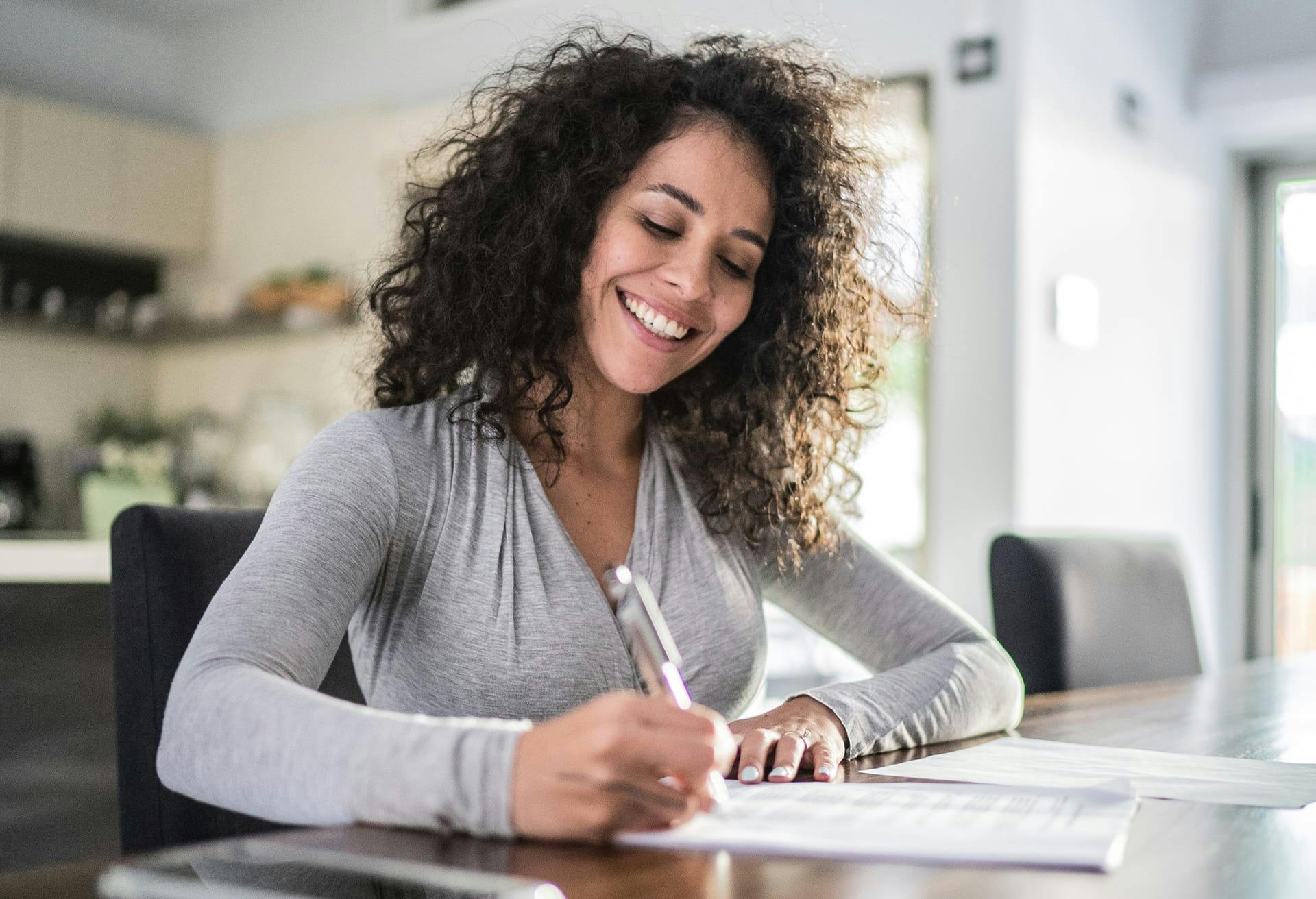 Woman writing on a piece of paper