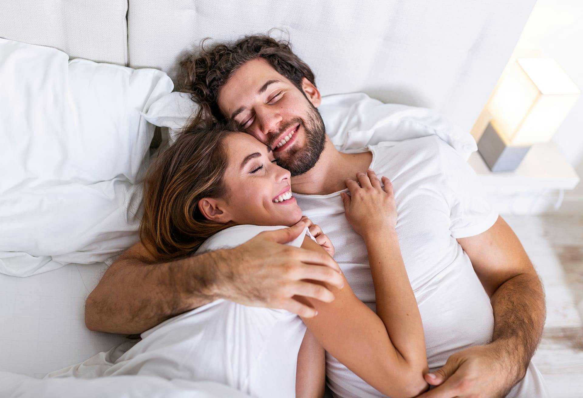 Man and woman in bed together