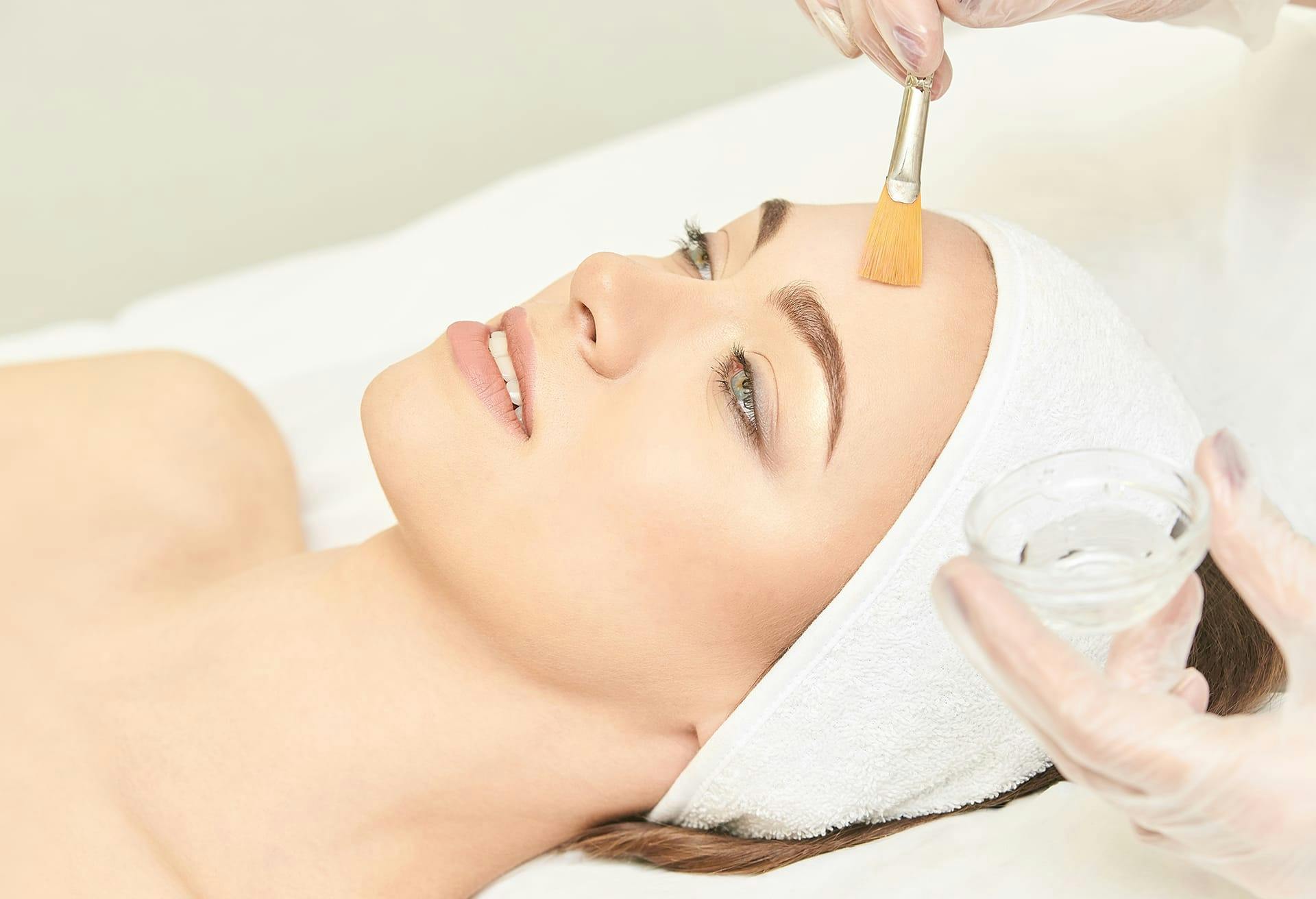 Woman recieving facial treatment