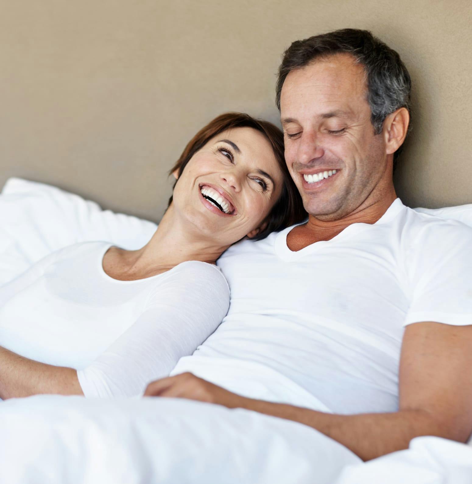 Man and woman in bed together