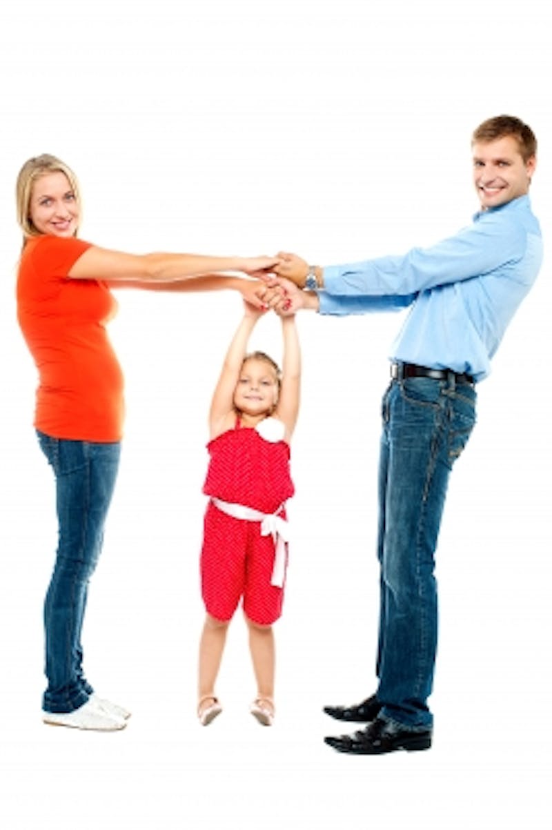 family holding hands together with child