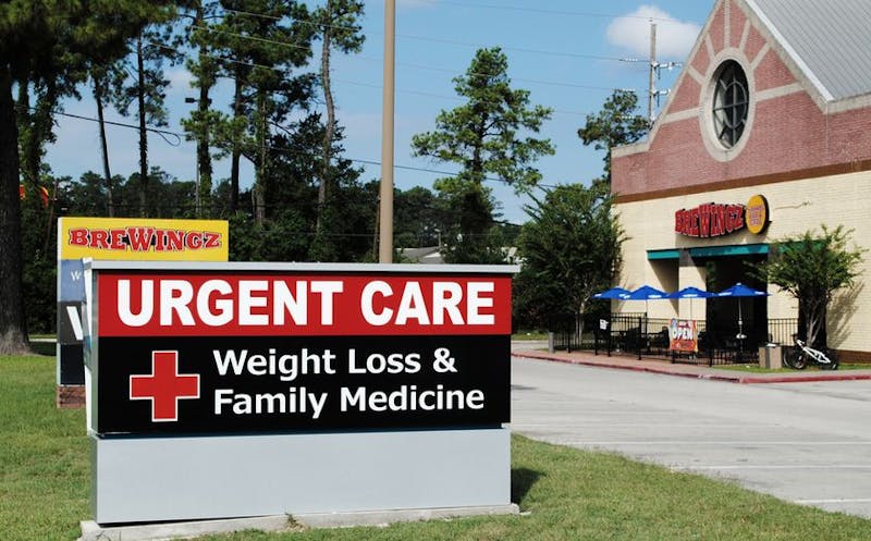 sign in front of a fast food building that says urgent care weight loss