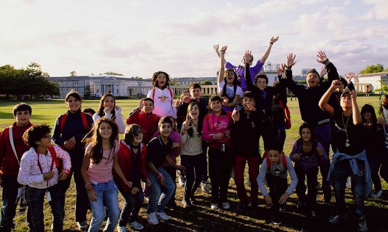 group of people posing for a picture in a field
