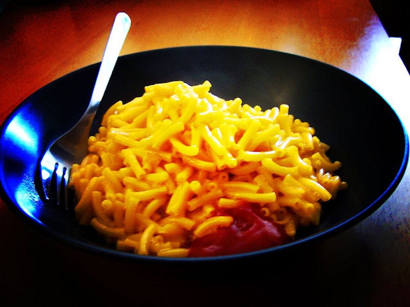 macaroni and cheese in a bowl with a fork