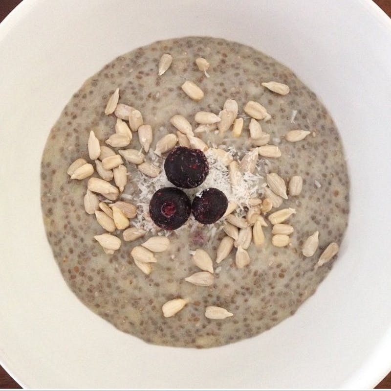 with nuts and berries in a bowl of oatmeal