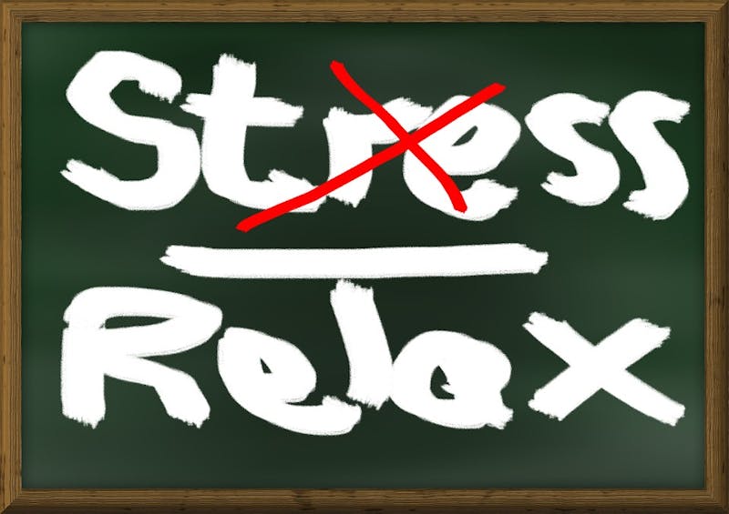 a blackboard with a chalkboard with the words stress and relax written on it