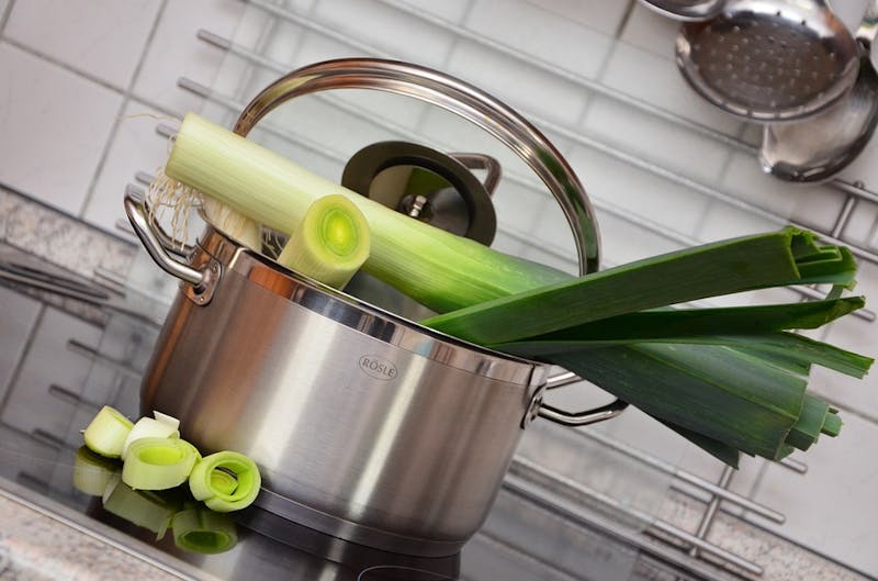 there is a pot with a bunch of green vegetables in it