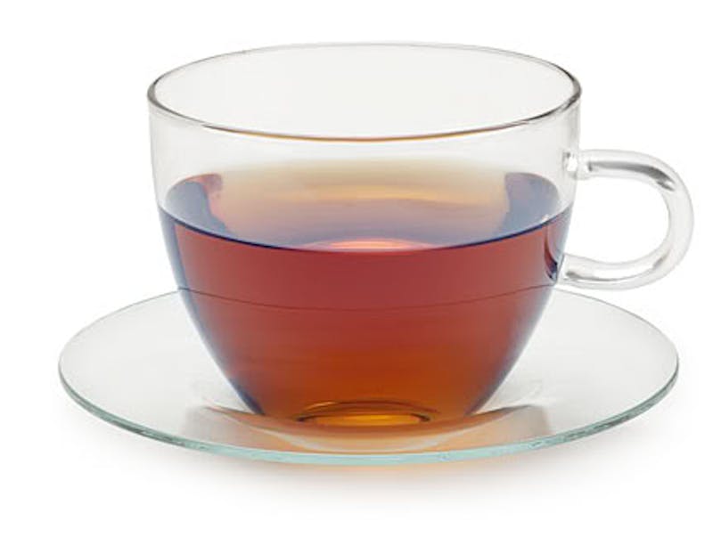 there is a cup of tea on a saucer on a white background