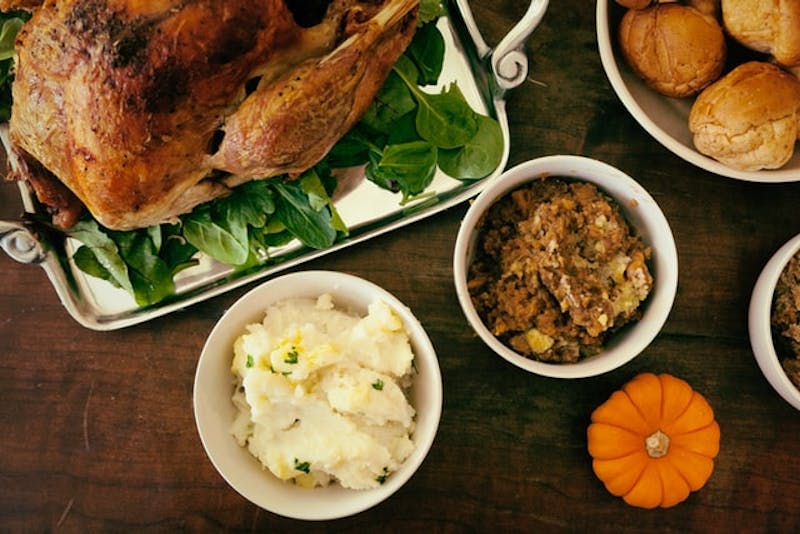 a close up of a turkey on a platter with other dishes