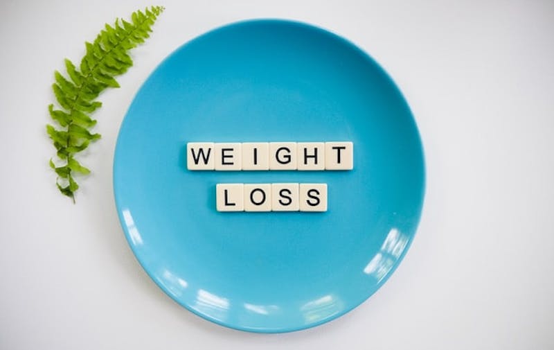 weight loss in scrabble letters on a plate