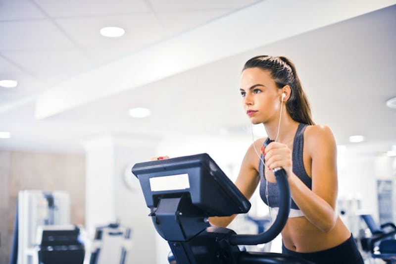 woman on a stationary bike in a gym