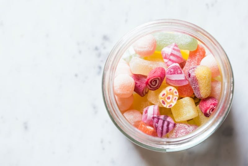 a jar of candy that is sitting on a table