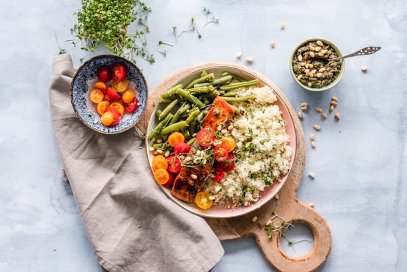 a bowl of rice and vegetables on a table