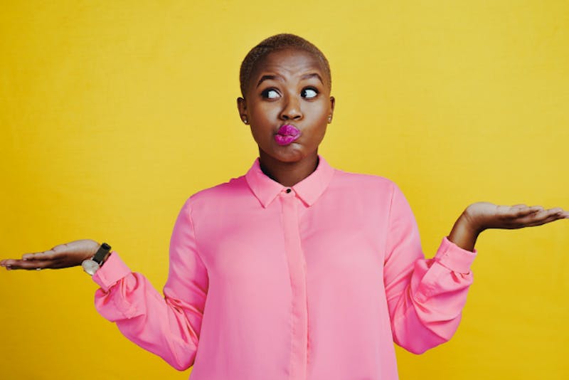 a woman with a surprised look on her face and hands out to sides