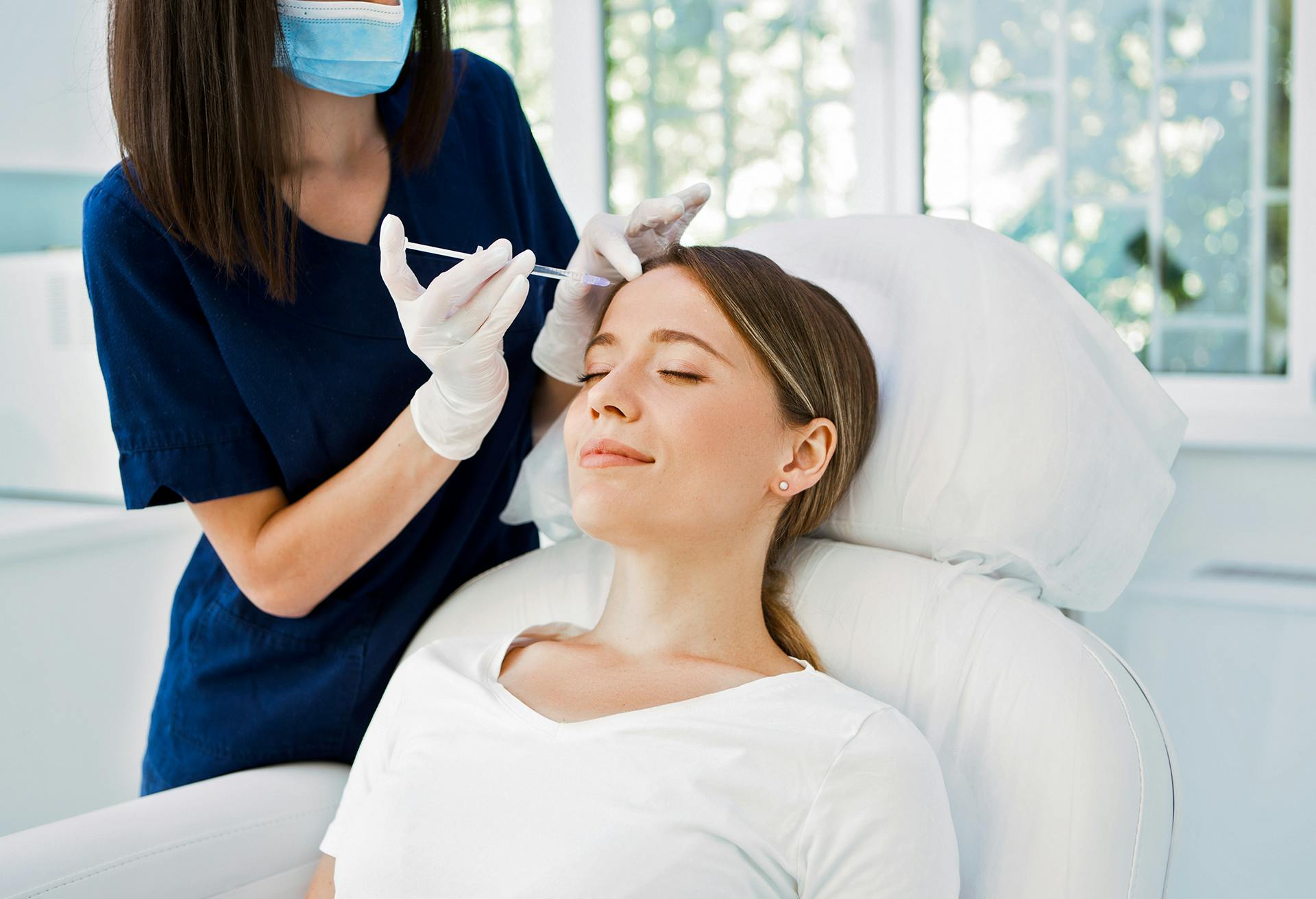 Woman getting facial injections