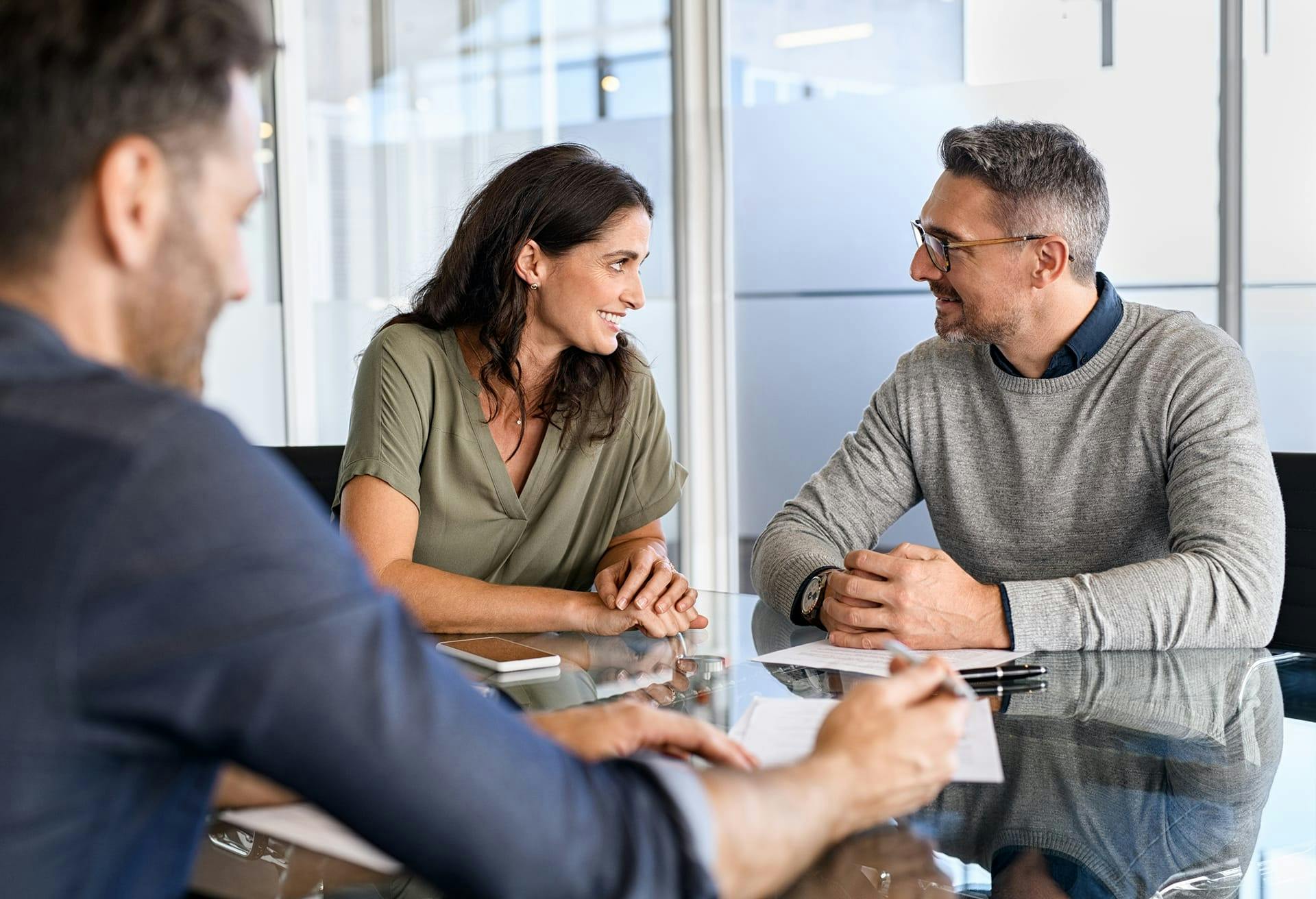 Men and a woman having a meeting