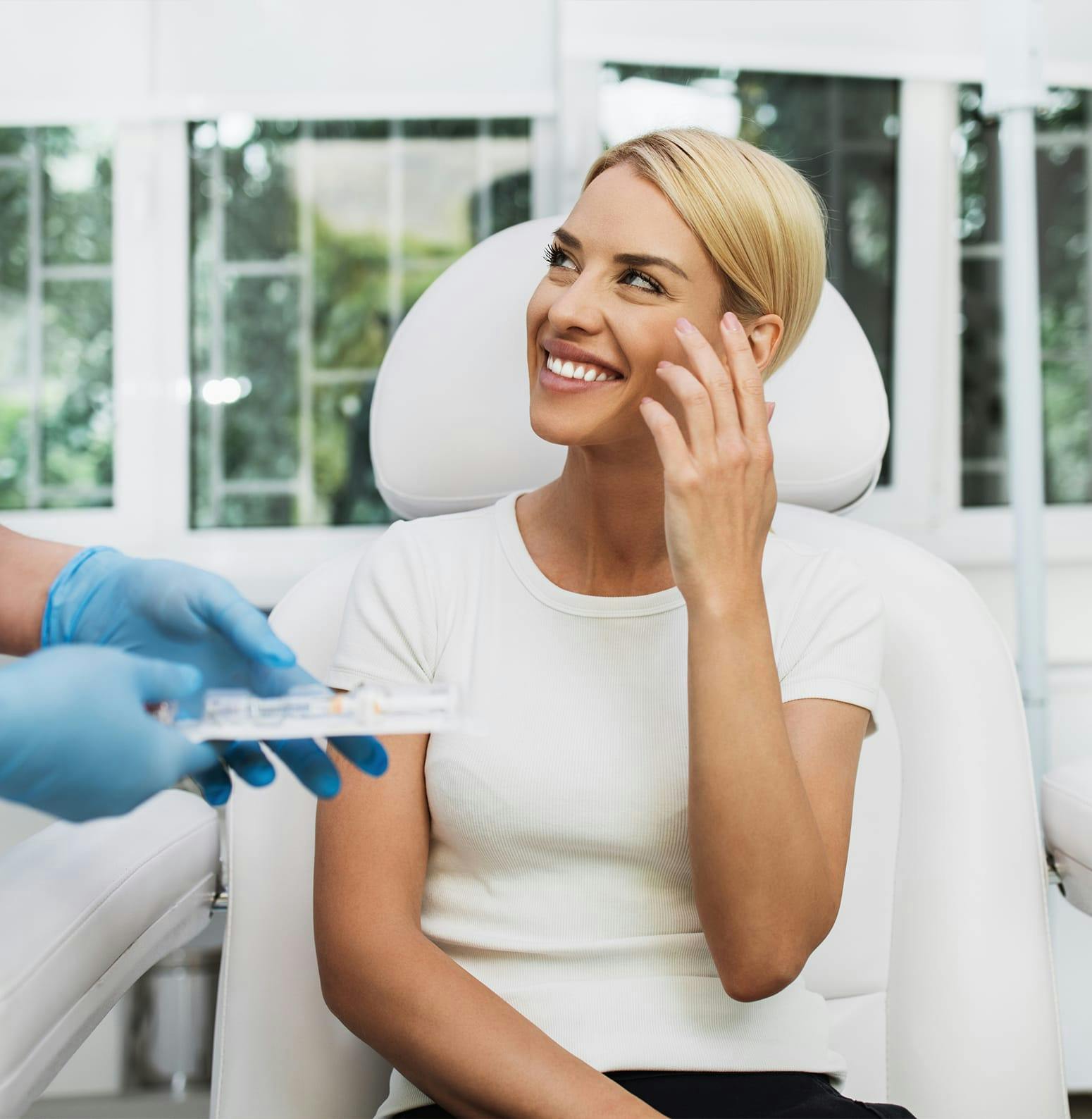Woman smiling at a doctor awaiting injections