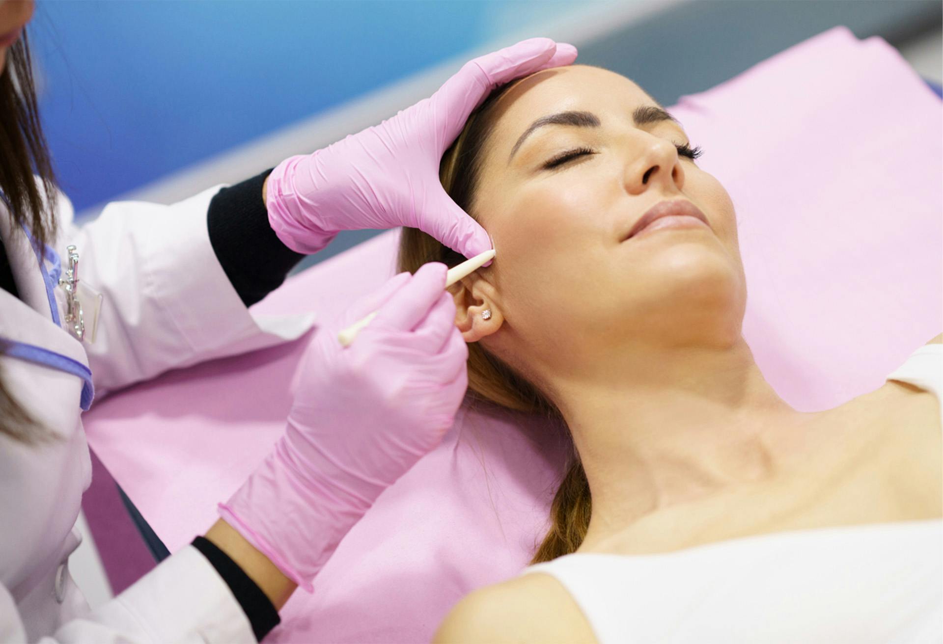 Woman getting facial injections