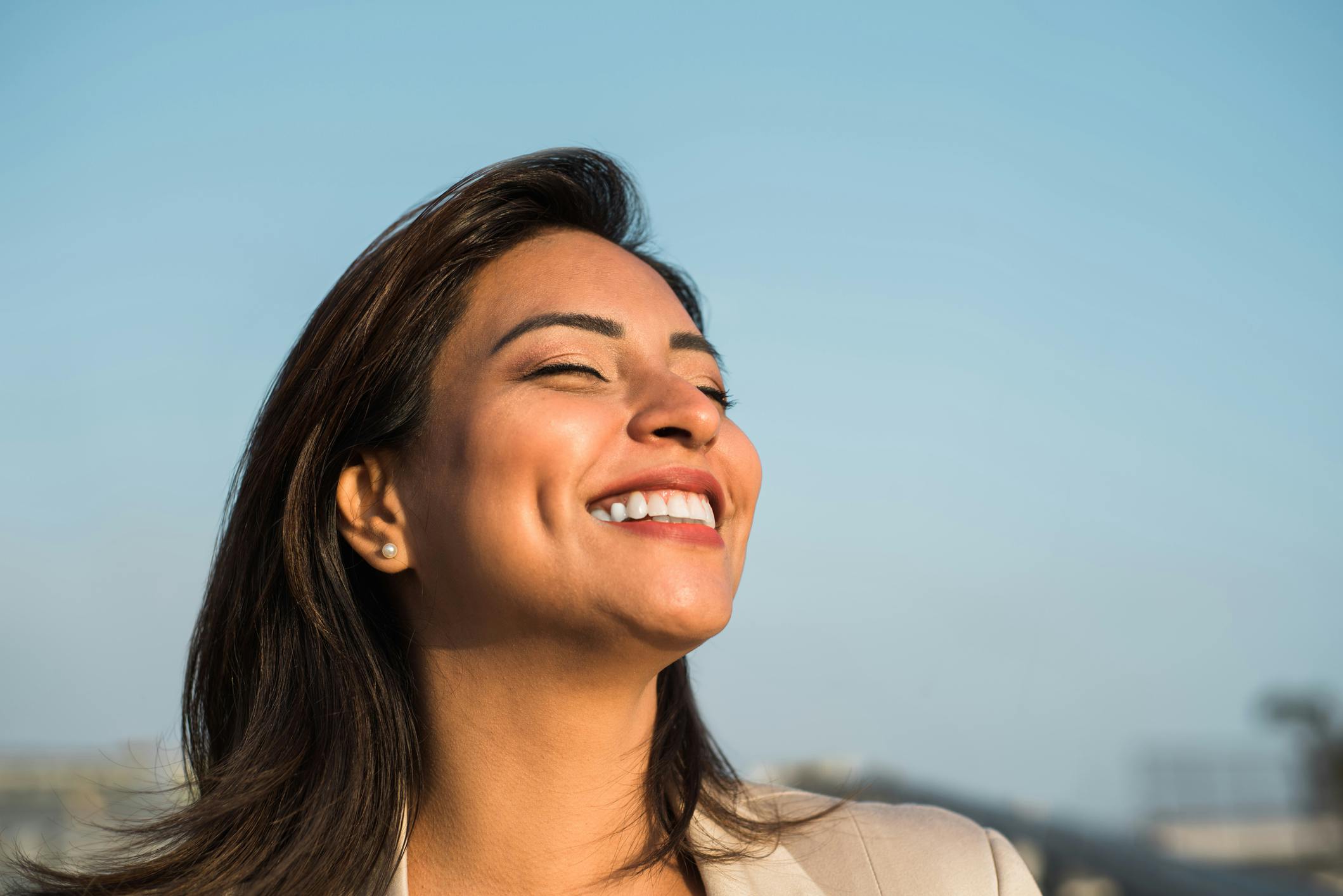 woman closed eyes smiling upwards